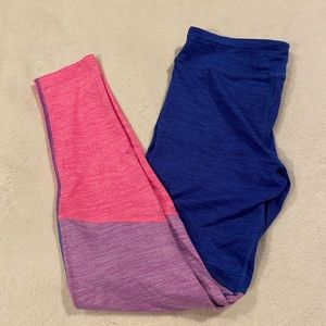 Blue, purple, and pink layered exercise leggings